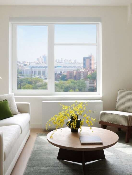 spacious living room with modern, artful decor at Estela apartments in Mott Haven